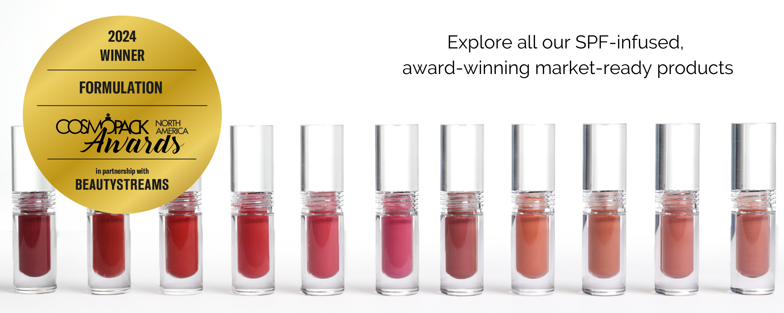 2 A row of multicolored bottles of lip oil.