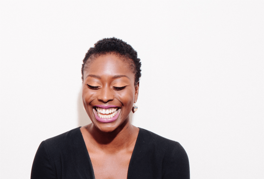 A woman laughing.