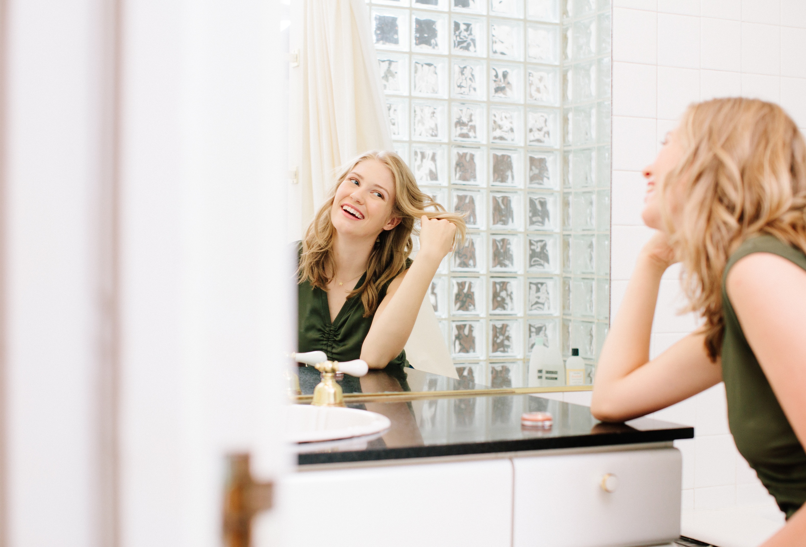 Woman with blond hair using makeup