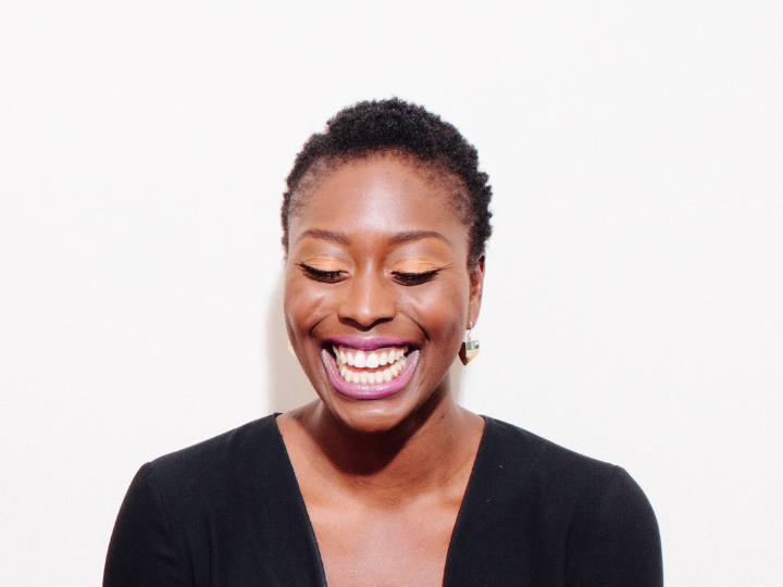 Woman wearing eye makeup laughing